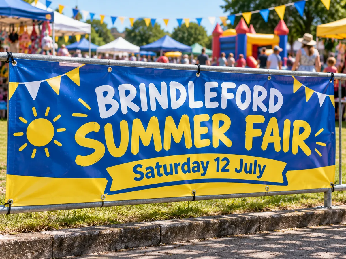 Printed PVC banner with eyelets cable-tied to railings at a school summer fair